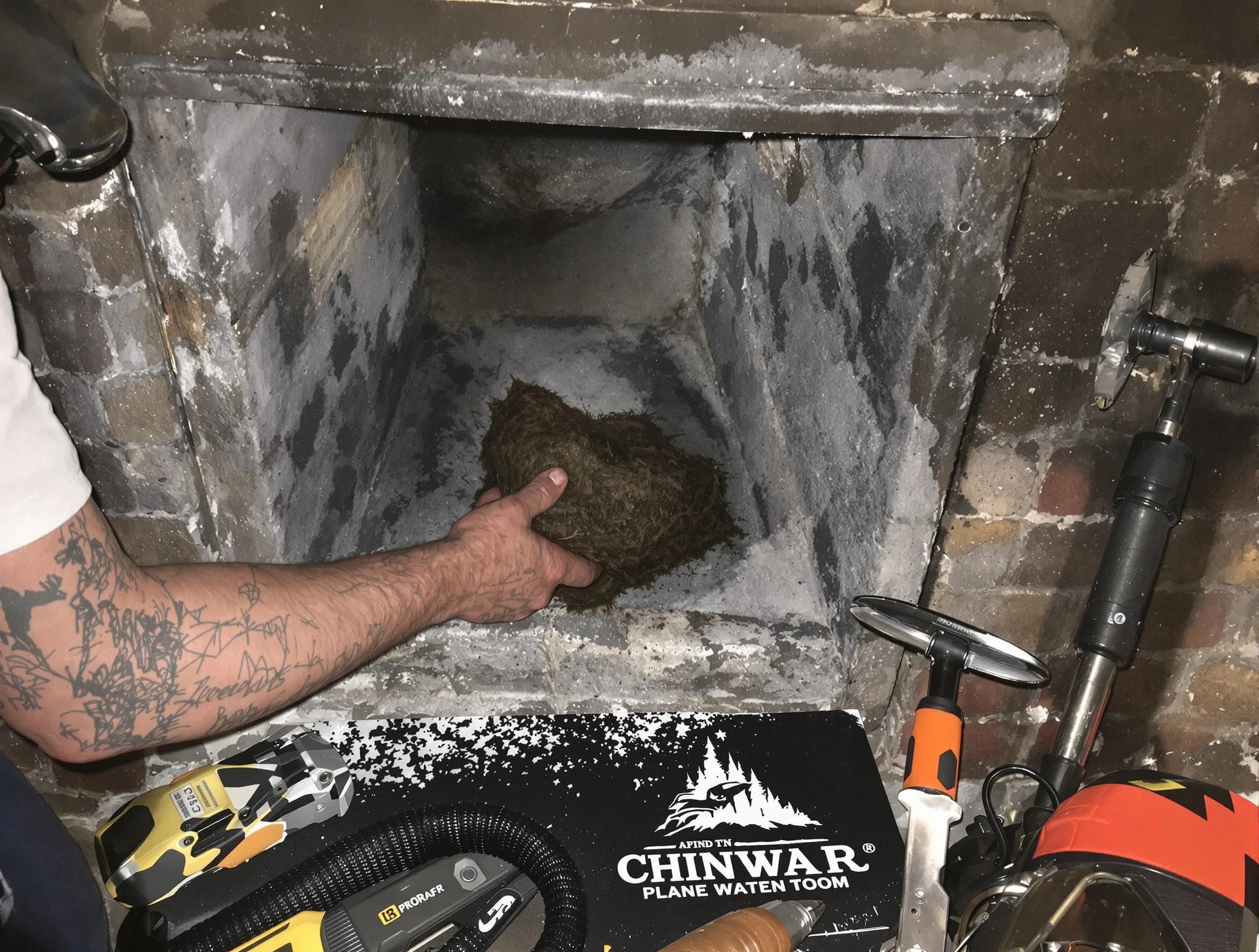 Springville Chimney Sweep safely removing debris and screening chimney in Springville, AL